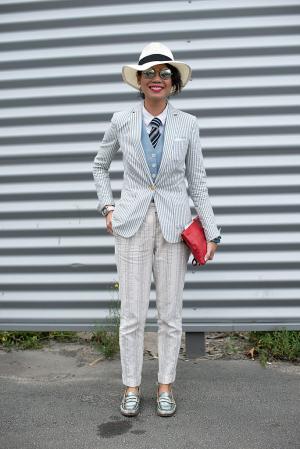 PARIS, FRANCE - JUNE 27: Fashion editor at Esquire Singapore Janie Cai wearing a Masiimo Dutto jacket and trousers, Churches shoes, Tory Burch bag, vintage sunglasses, Uniqlo hat and shirt and a menswear waistcoat on day 3 of Paris Collections: Men on JUNE 27, 2014 in Paris, France. (Photo by Kirstin Sinclair/Getty Images)